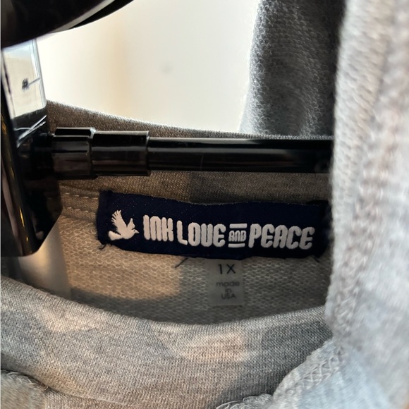 Ink, Love and Peace Women’s Camo Hoodie
NWT, Size 1X - Picture 2 of 4